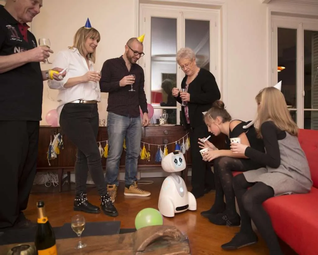 Buddy the robot interacting with a family